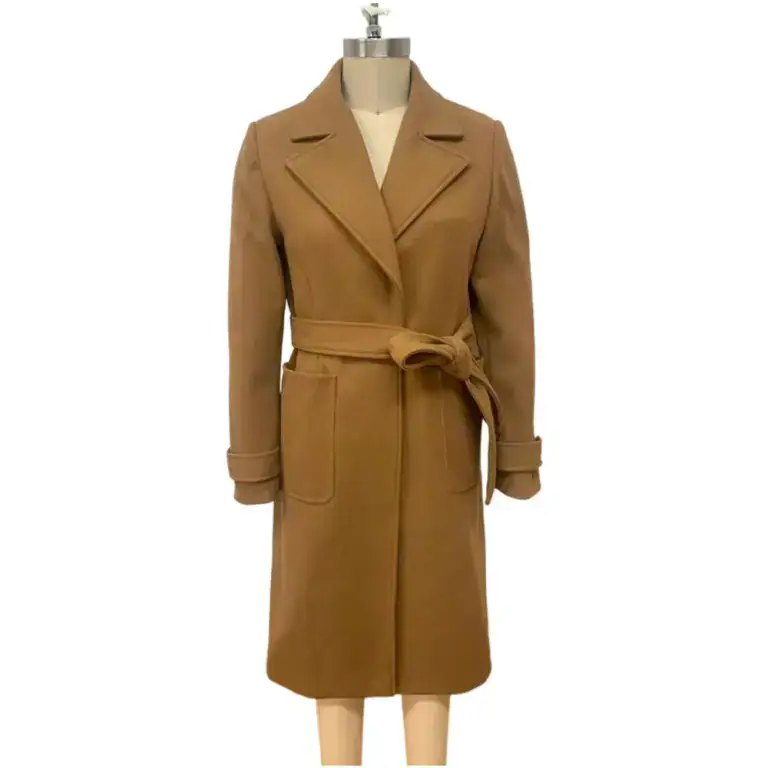 Elegant woven overcoat in camel color with a belt, lapel collar, and large front pockets, perfect for fall and winter fashion.