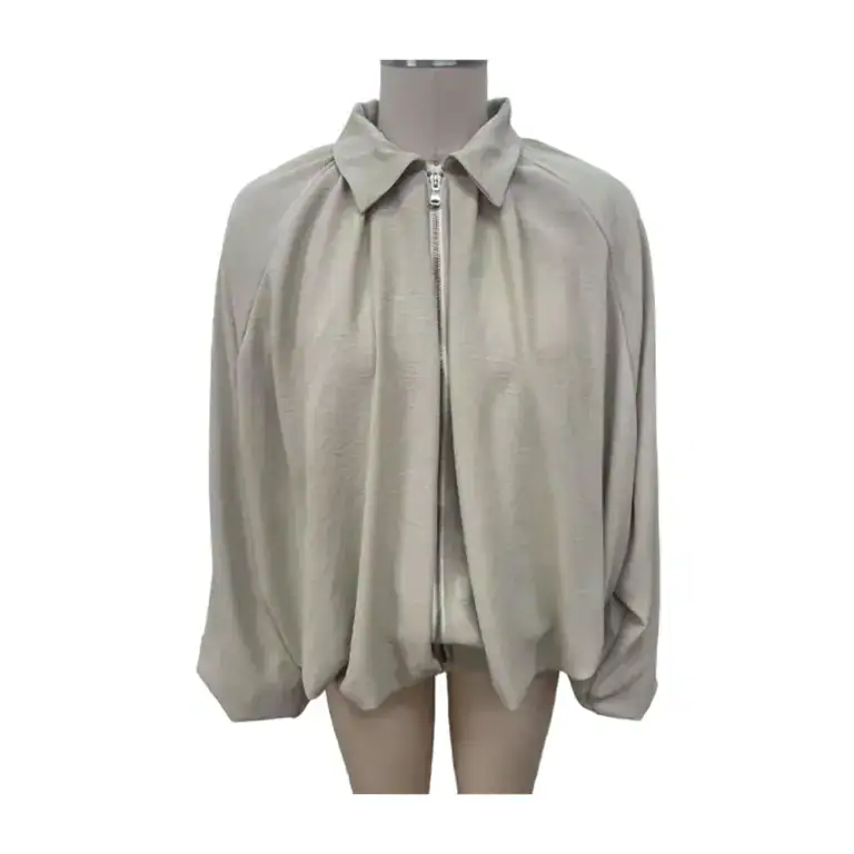 Beige zip-up jacket with a classic collar and loose fit, displayed on a mannequin for fashion showcase.