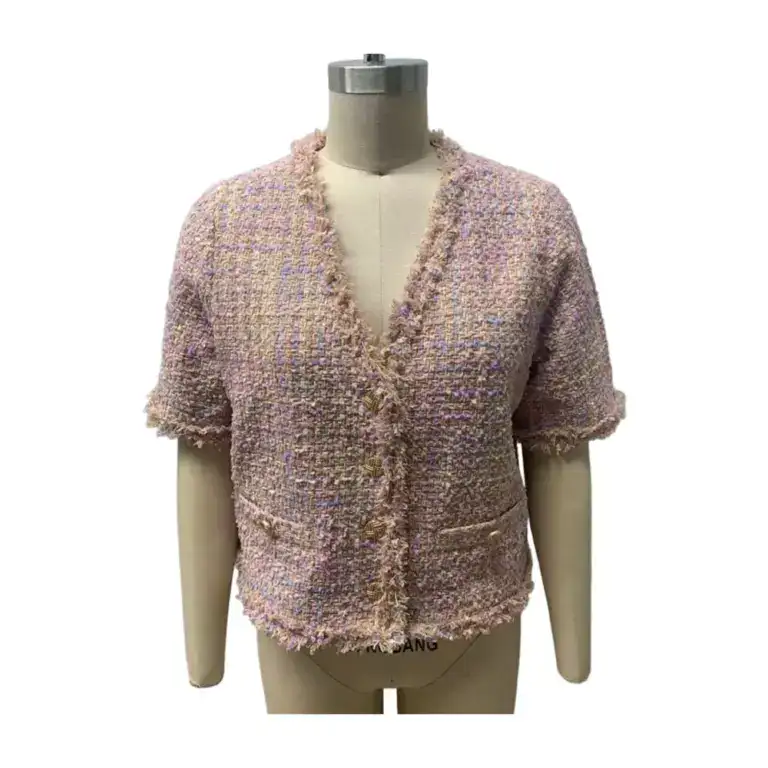 Chic pink tweed short sleeve jacket with textured fabric and frayed edges, perfect for stylish casual or semi-formal wear.