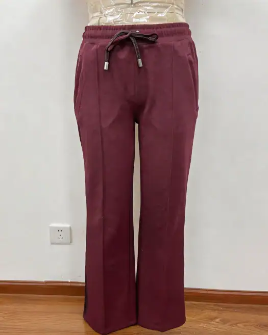 Maroon wide-leg sweatpants with drawstring waist, perfect for casual wear and lounging, made from soft, cozy fabric.
