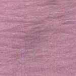 Close-up of pink fabric with soft texture, suitable for fashion and clothing design.