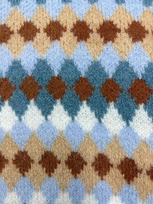 Close-up of a vibrant argyle pattern wool sweater featuring shades of blue, brown, beige, and white, showcasing a classic and cozy design.
