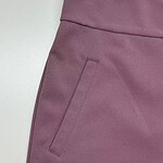 Close-up of mauve women's pants showing the waistband and side pocket, perfect for casual or office wear.