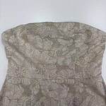 Close-up of a fabric with a subtle floral pattern, suitable for fashion and clothing design projects.