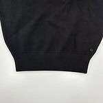 Close-up of a black sweatshirt featuring the word 'Venice' in white letters, showcasing casual fashion style.