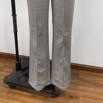 Women's checkered trousers with a high waist and wide-leg fit, suitable for professional or casual wear, displayed on a mannequin.