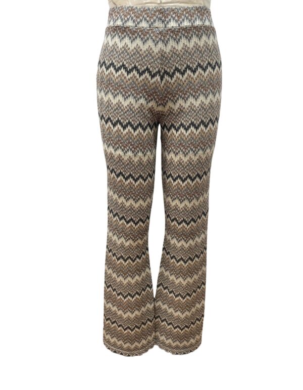 Stylish bohemian wide-leg pants with zigzag pattern in neutral tones, perfect for casual or festival wear, made from comfortable fabric.