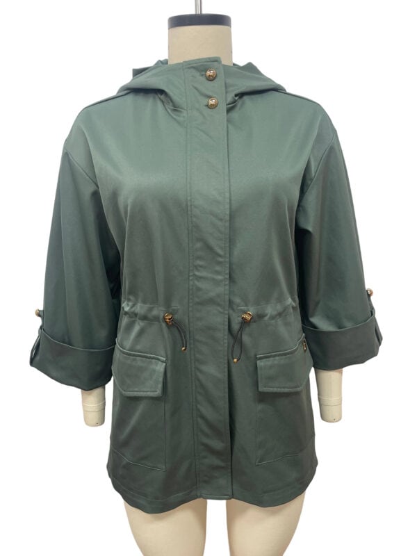 Elegant green hooded raincoat with adjustable drawstrings, large front pockets, and rolled-up sleeves, perfect for rainy weather and casual outings.