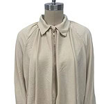 Cream zip-up jacket with a classic collar, long sleeves, and a relaxed fit, perfect for casual or sporty outfits.