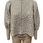 Luxurious cream-colored women's jacket with intricate embroidery and puffed sleeves, perfect for formal occasions or stylish outings.