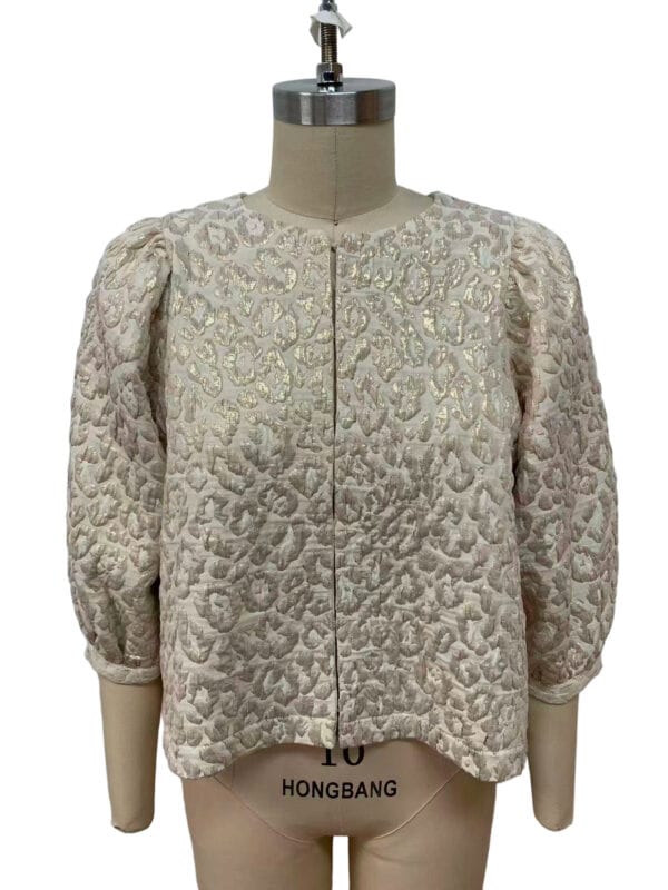 Luxurious cream-colored women's jacket with intricate embroidery and puffed sleeves, perfect for formal occasions or stylish outings.