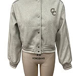 Stylish grey varsity jacket with snap buttons, ribbed cuffs and collar, and embroidered logo on the chest, perfect for casual and sporty outfits.