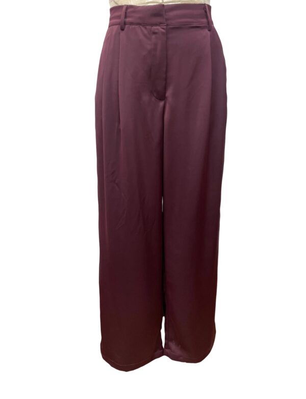 Stylish wide-leg burgundy trousers perfect for office wear or casual outings, made from high-quality fabric with a comfortable fit and modern design.