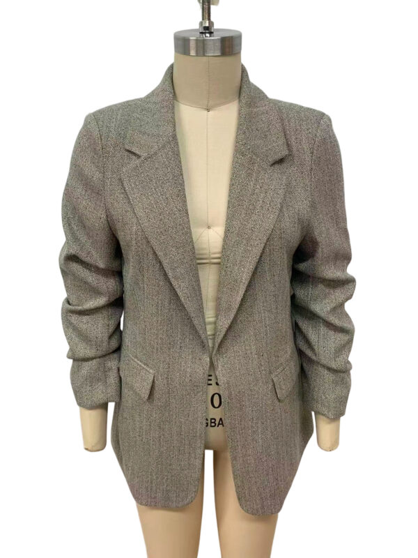 Stylish women's grey blazer with a tailored fit, lapel collar, and structured shoulders, perfect for professional or casual wear.