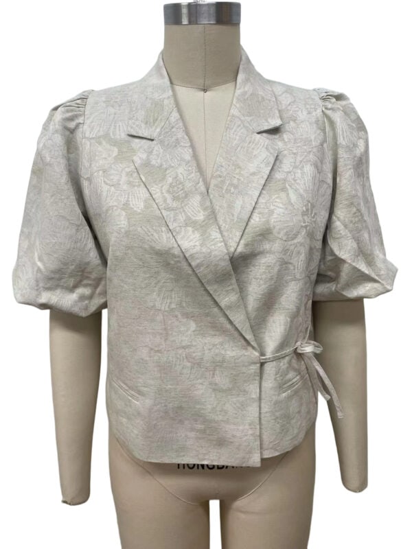 Stylish light gray blazer with puff sleeves and a tie waist, perfect for formal or business casual occasions.