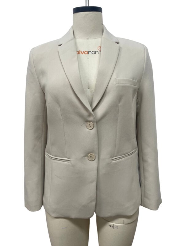 Light beige women's blazer with tailored fit, notched lapel, two-button closure, and front pockets, suitable for professional or formal occasions.