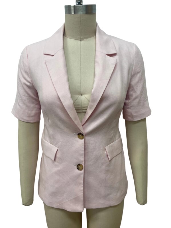 Stylish light pink women's blazer with short sleeves, tailored fit, and two front buttons, perfect for professional or casual wear.