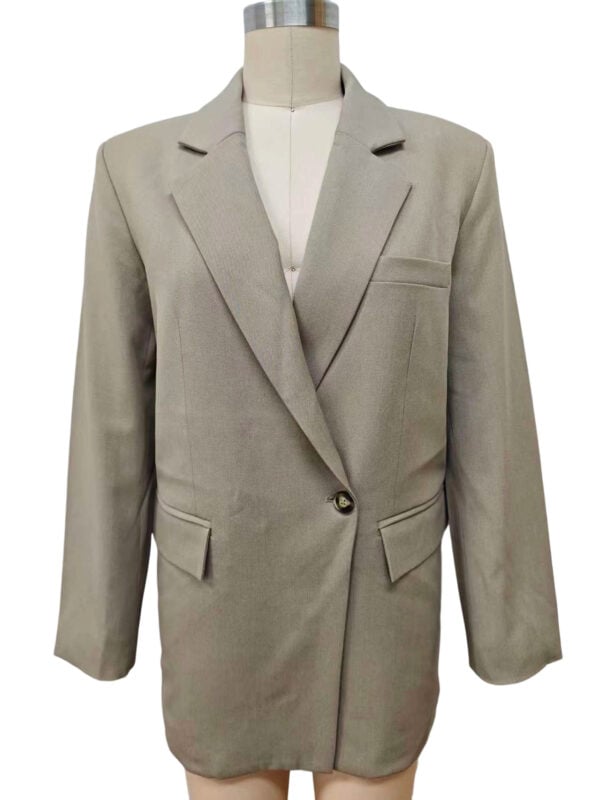 Stylish beige women's blazer with tailored fit, notched lapels, and front pockets, perfect for professional or casual wear.