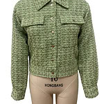 Stylish green tweed jacket with button closure and collar, perfect for casual or formal wear, displayed on a mannequin.
