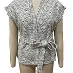 Stylish women's blouse with a geometric pattern, short sleeves, and a waist tie, perfect for casual or office wear.