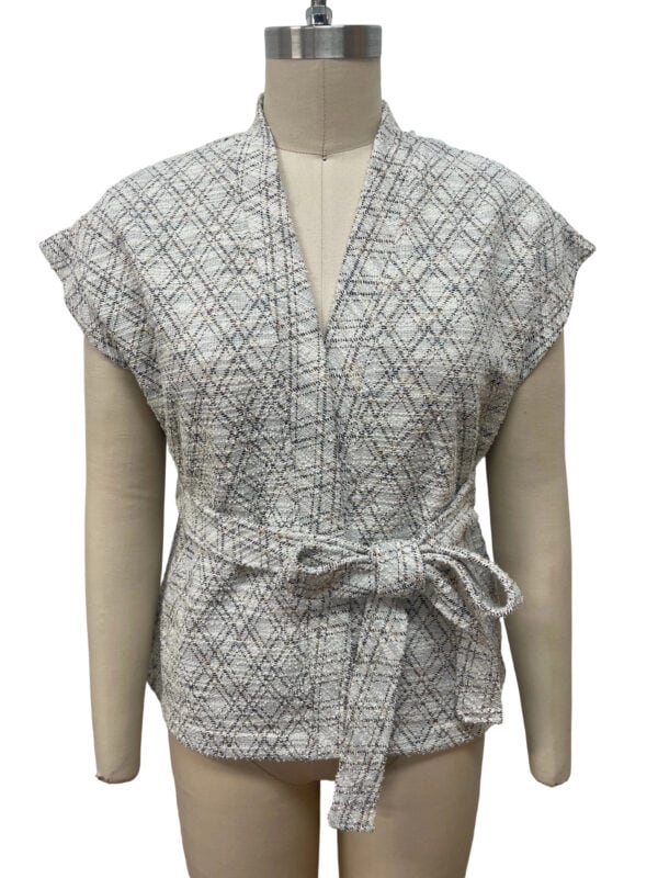 Stylish women's blouse with a geometric pattern, short sleeves, and a waist tie, perfect for casual or office wear.