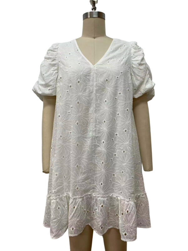 White eyelet dress with puff sleeves and ruffled hem, perfect for summer or casual occasions, featuring floral embroidery and breathable fabric.