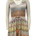 Long maxi dress with multicolored zigzag pattern, sleeveless design, V-neckline, and drawstring waist, perfect for summer or casual wear.