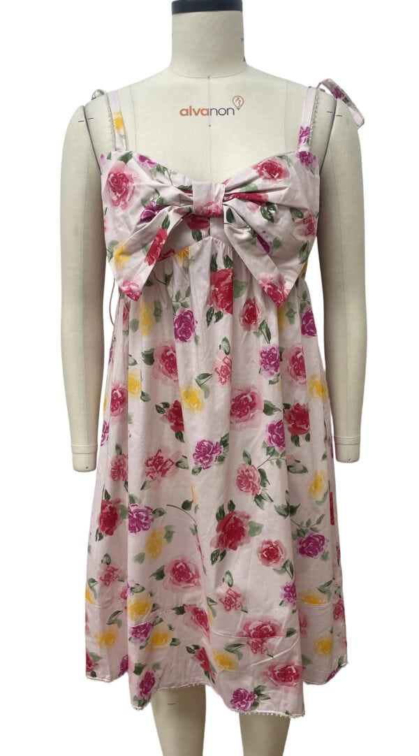 Elegant floral summer dress with a large bow on the front, featuring pink, yellow, and purple flowers on a white background, perfect for warm weather and casual outings.