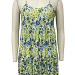 Lightweight floral summer dress with spaghetti straps, featuring a vibrant blue and green flower pattern, perfect for warm weather and casual outings.