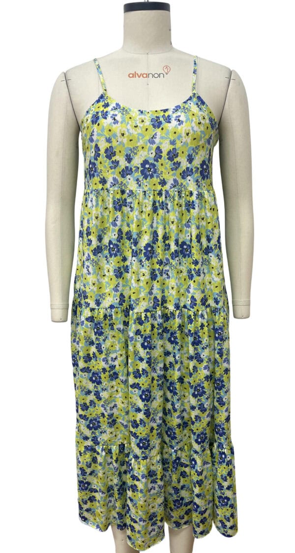 Lightweight floral summer dress with spaghetti straps, featuring a vibrant blue and green flower pattern, perfect for warm weather and casual outings.