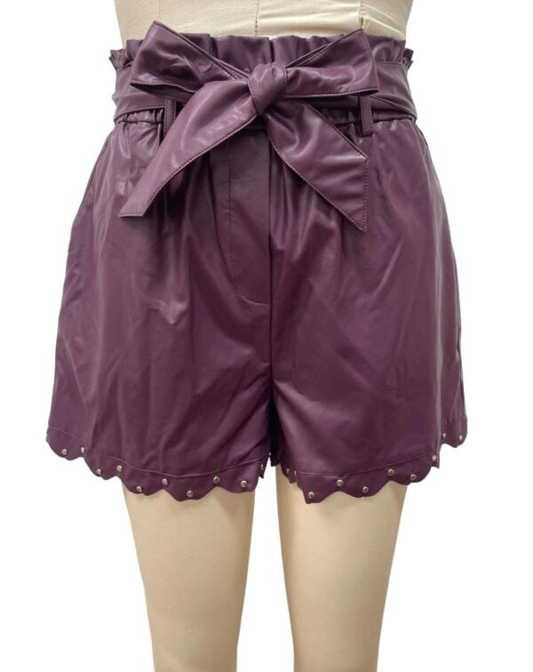 Stylish purple satin shorts with a high waist and bow tie, featuring decorative pearl accents at the hem, perfect for fashionable summer wear.