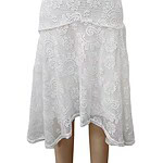 Stylish white crochet skirt with intricate lace patterns, perfect for summer or casual wear, showcasing detailed craftsmanship and lightweight fabric.