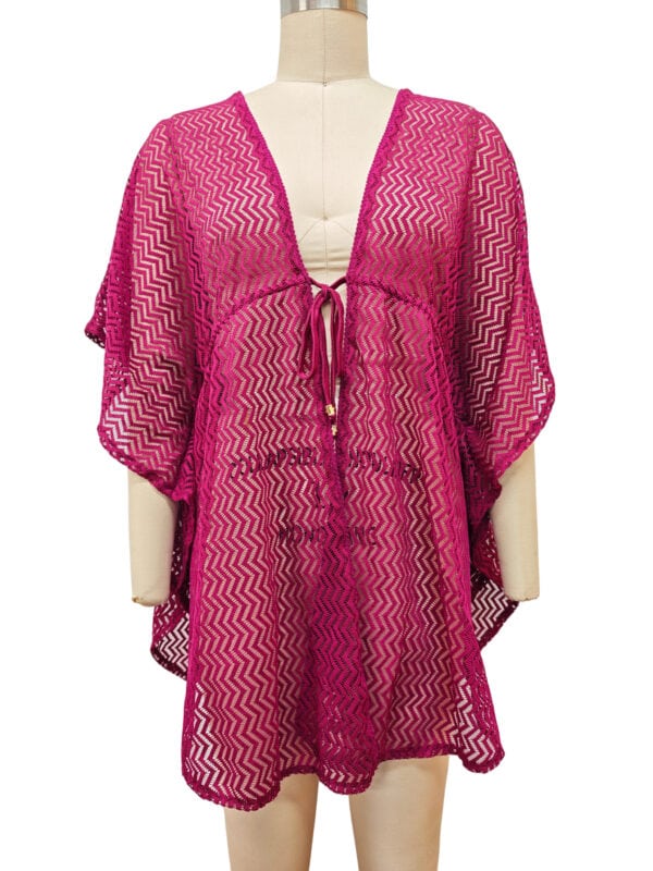 Vibrant pink crochet cover-up with zigzag pattern, featuring a front tie and loose fit, perfect for beach or poolside fashion.