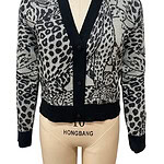 Stylish women's leopard print cardigan with black trim, perfect for casual or office wear, made from comfortable knit fabric.