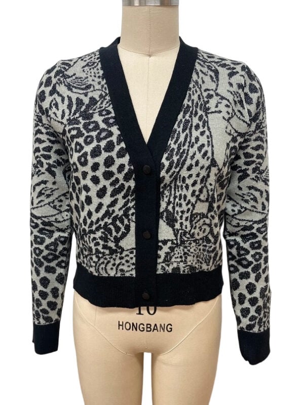 Stylish women's leopard print cardigan with black trim, perfect for casual or office wear, made from comfortable knit fabric.