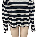 Women's black and white striped turtleneck sweater, cozy and stylish, perfect for fall and winter fashion.
