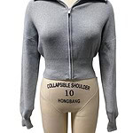 Front view of a grey zip-up hoodie with a collar, fitted at the waist, displayed on a mannequin for fashion and casual wear.