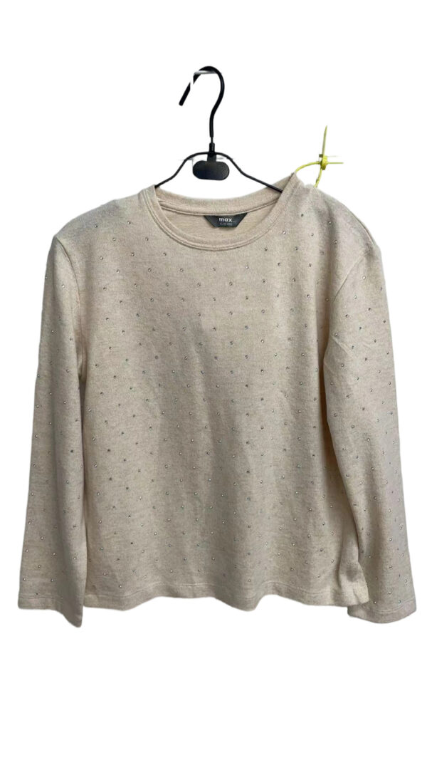 Light gray women's sweater with small decorative dots, long sleeves, and a round neckline, hanging on a black hanger.