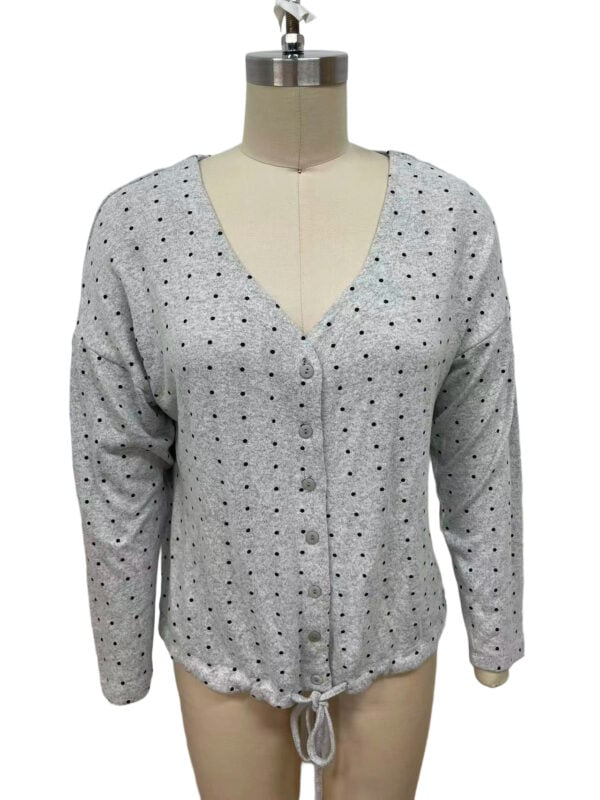 Women's grey cardigan with black polka dots, V-neck, button-up front, and drawstring hem, suitable for casual and office wear.