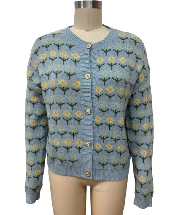 Light blue women's cardigan with yellow and green floral pattern, button-up front, and ribbed cuffs and collar, perfect for casual or office wear.