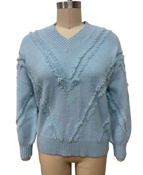 Light blue women's sweater with textured, frayed diagonal lines and a V-neck, perfect for casual or stylish winter wear.