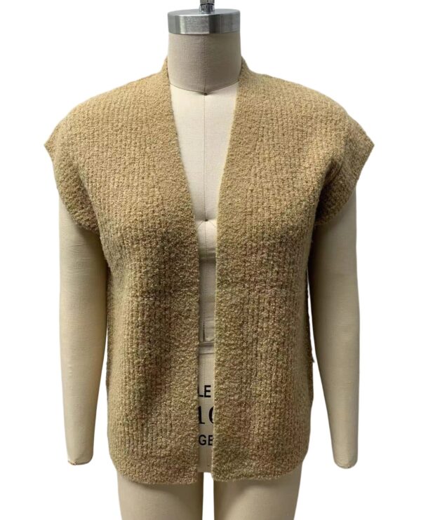 Stylish beige knitted vest displayed on a mannequin, perfect for layering in fall and winter fashion.