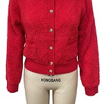 Elegant red knit cardigan with gold buttons, perfect for stylish winter or fall outfits, featuring a cozy and fashionable design.