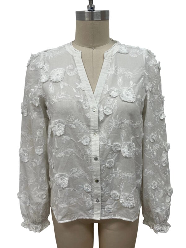 White women's blouse with floral embroidery, long sleeves, and button-up front, perfect for stylish casual or formal wear.