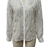 White embroidered blouse with floral cutouts, long sleeves, and a round neckline, perfect for casual or semi-formal occasions.
