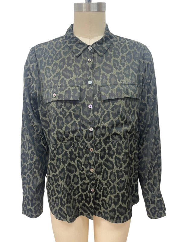 Stylish women's button-up shirt with a bold leopard print pattern, long sleeves, and chest pockets, perfect for casual or chic outfits.