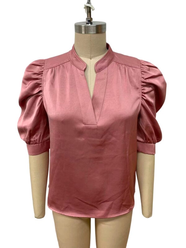 Stylish pink satin blouse with puff sleeves and a V-neckline, perfect for formal or casual occasions.