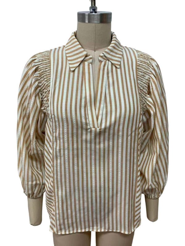 Elegant women's blouse with beige and white vertical stripes, puff sleeves, and a classic collar, perfect for casual or office wear.
