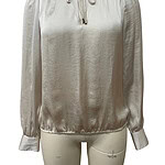 Elegant satin blouse with a high neckline, long sleeves, and a tie detail at the collar, perfect for stylish and sophisticated outfits.