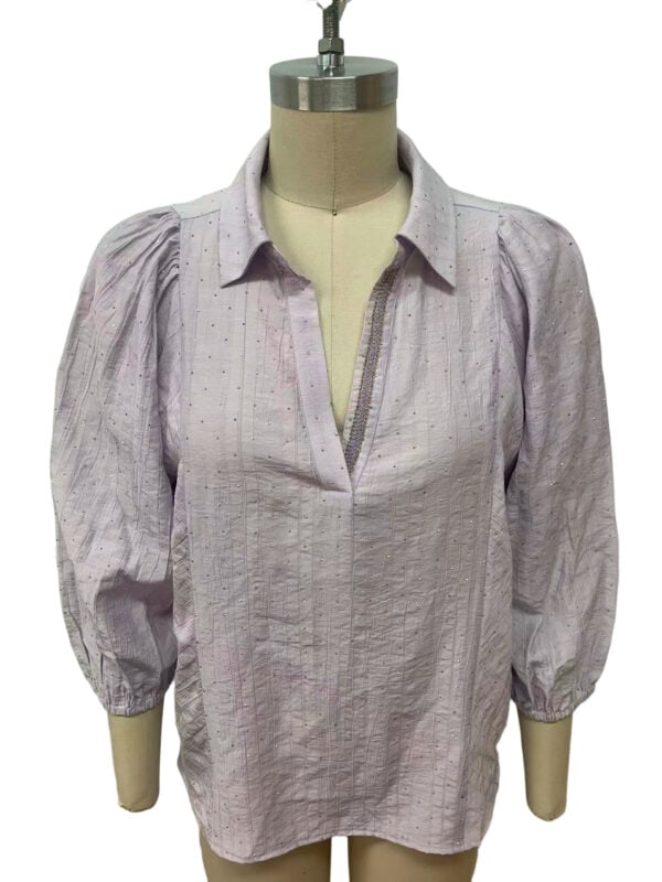 Light purple women's blouse with puffed sleeves and a V-neck, perfect for casual or office wear, made from comfortable, breathable fabric.